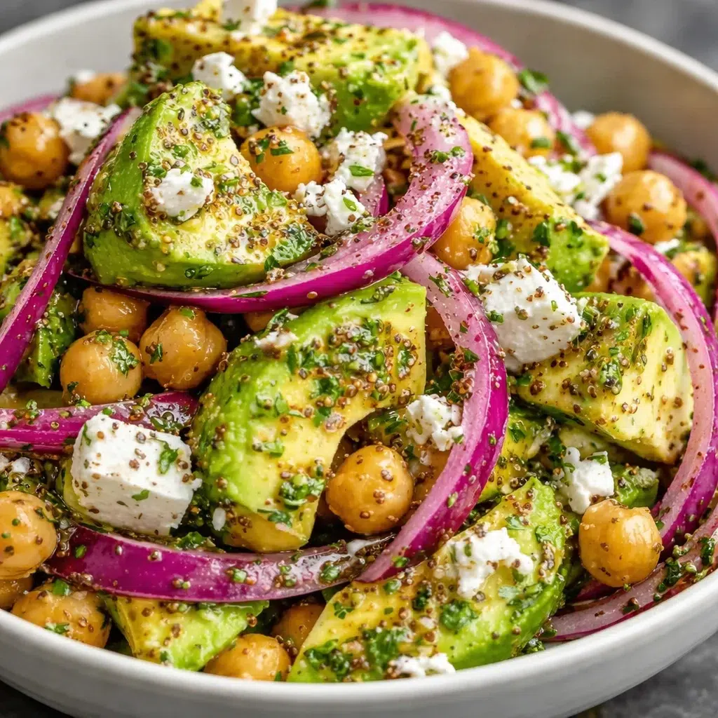Chickpea Feta Avocado Salad with fresh vegetables and feta cheese in a bowl.