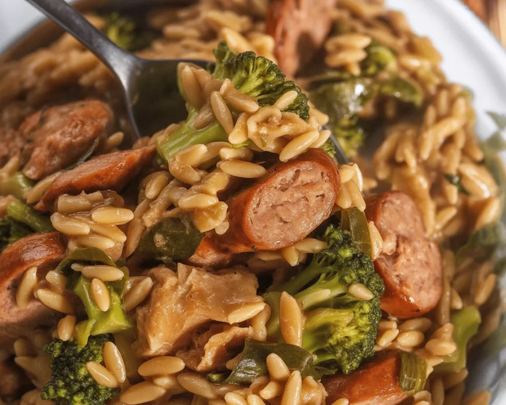 Chicken Sausage and Broccoli Orzo Skillet cooked in a large skillet with garlic and broth.