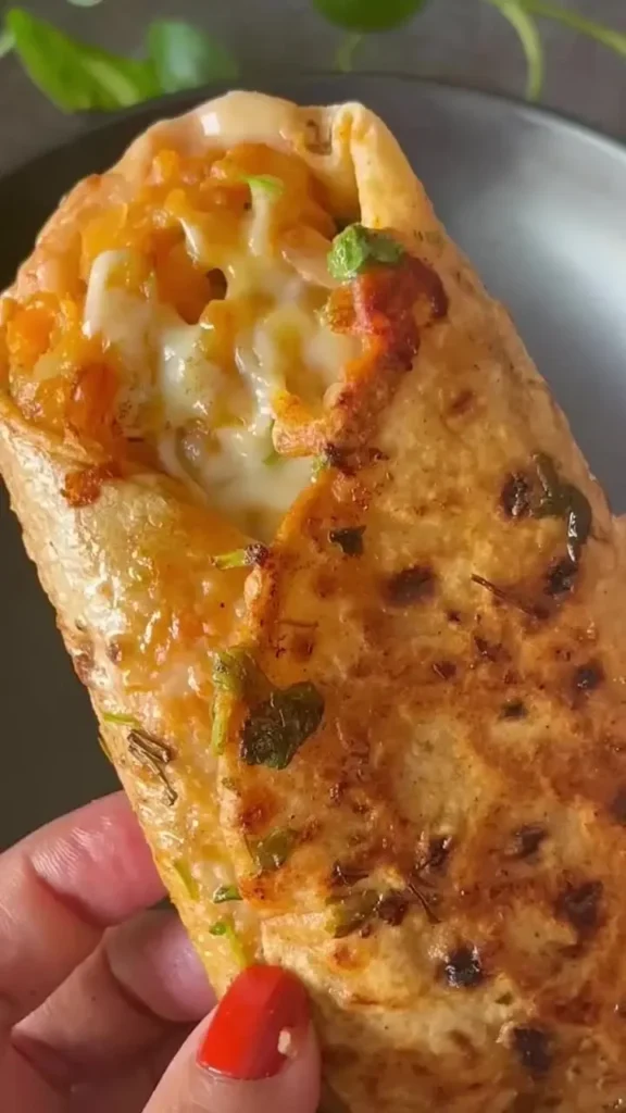 Spicy Schezwan Roti Roll with fresh vegetables and zesty flavors wrapped in chapati.