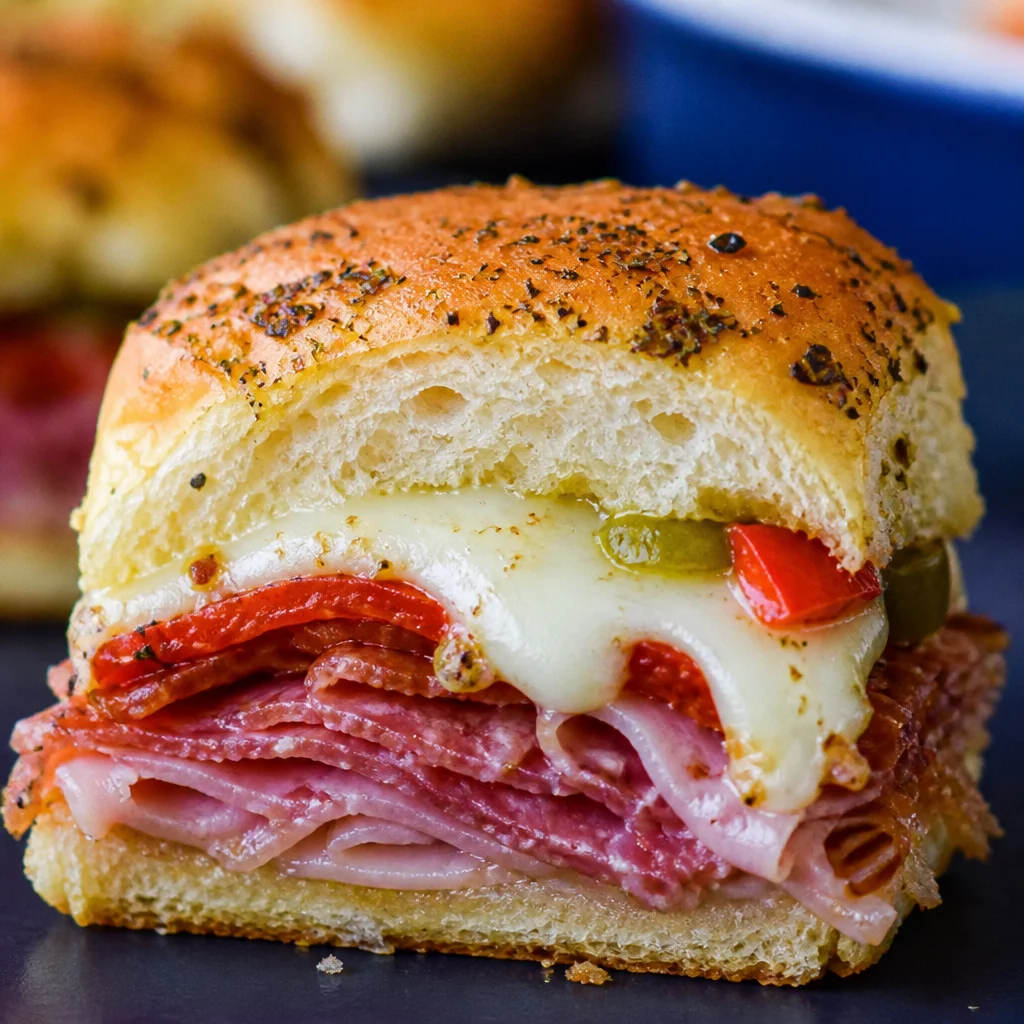 Delicious Hot Italian Sub Sliders with melted provolone and spicy peppers.